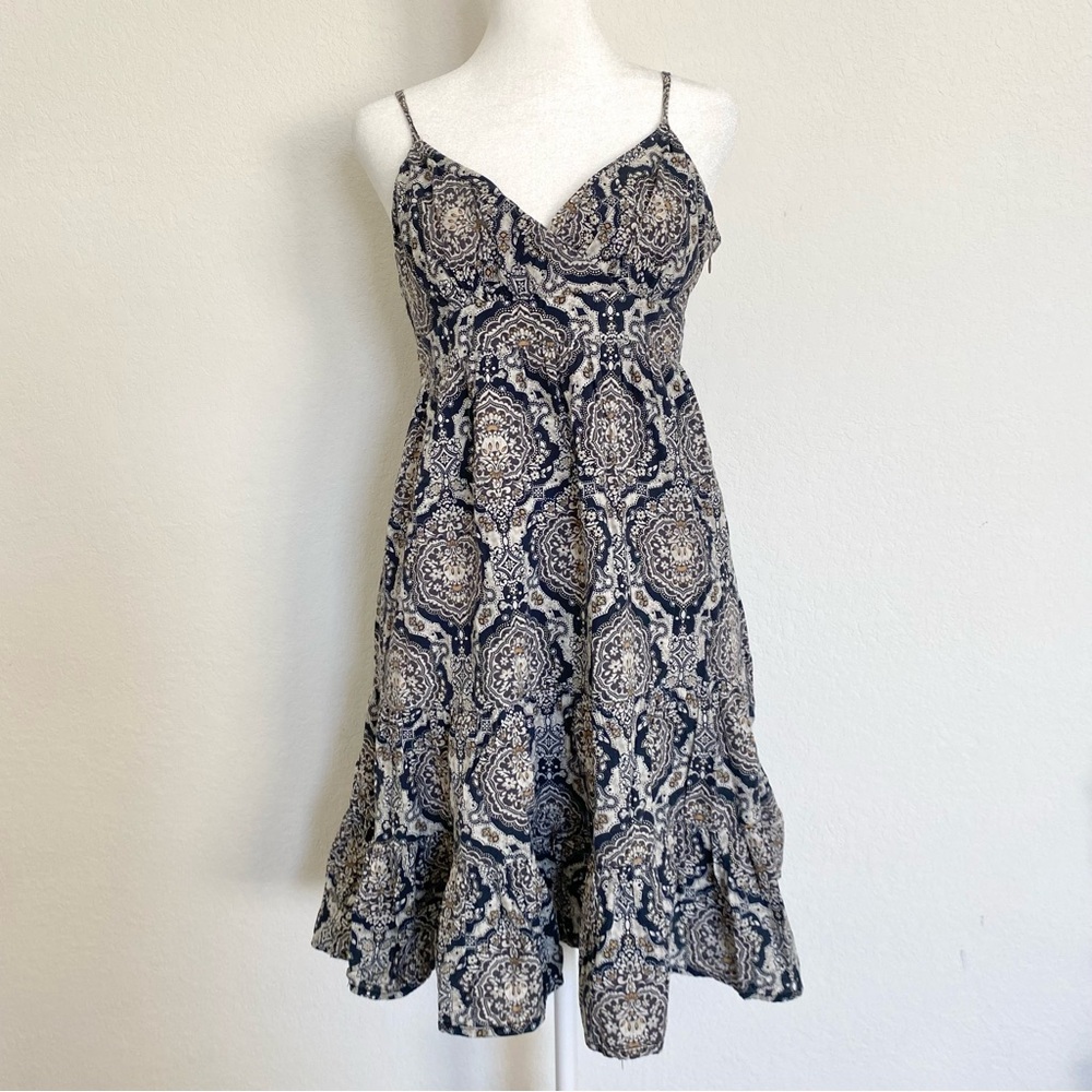 Blue and white paisley print midi dress with spaghetti straps and ruffle hem